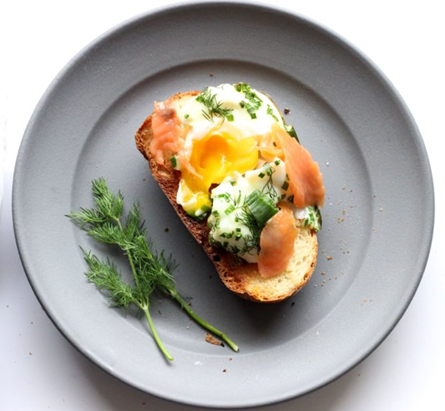 Baked salmon and eggs on bread